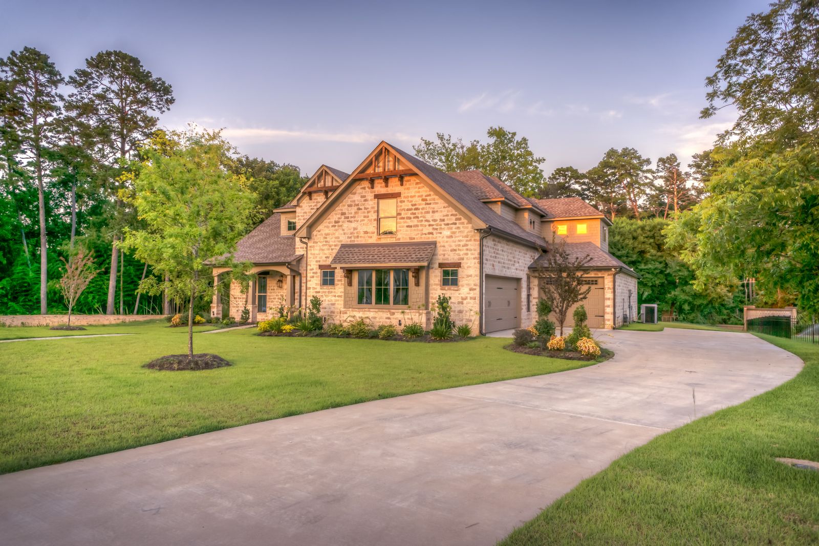 Twilight view of a house and front garden, the typical starting point for a residential lighting conversation